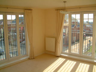 Lounge showing light fittings and curtains